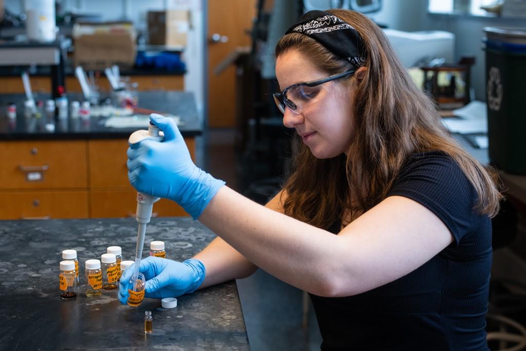 A student works on a science lab for class